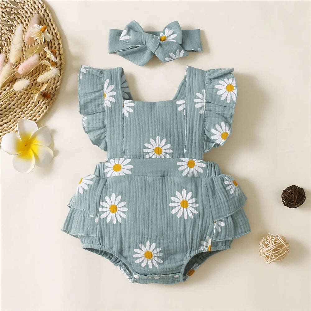 Adorable baby girl fancy romper with a headband.