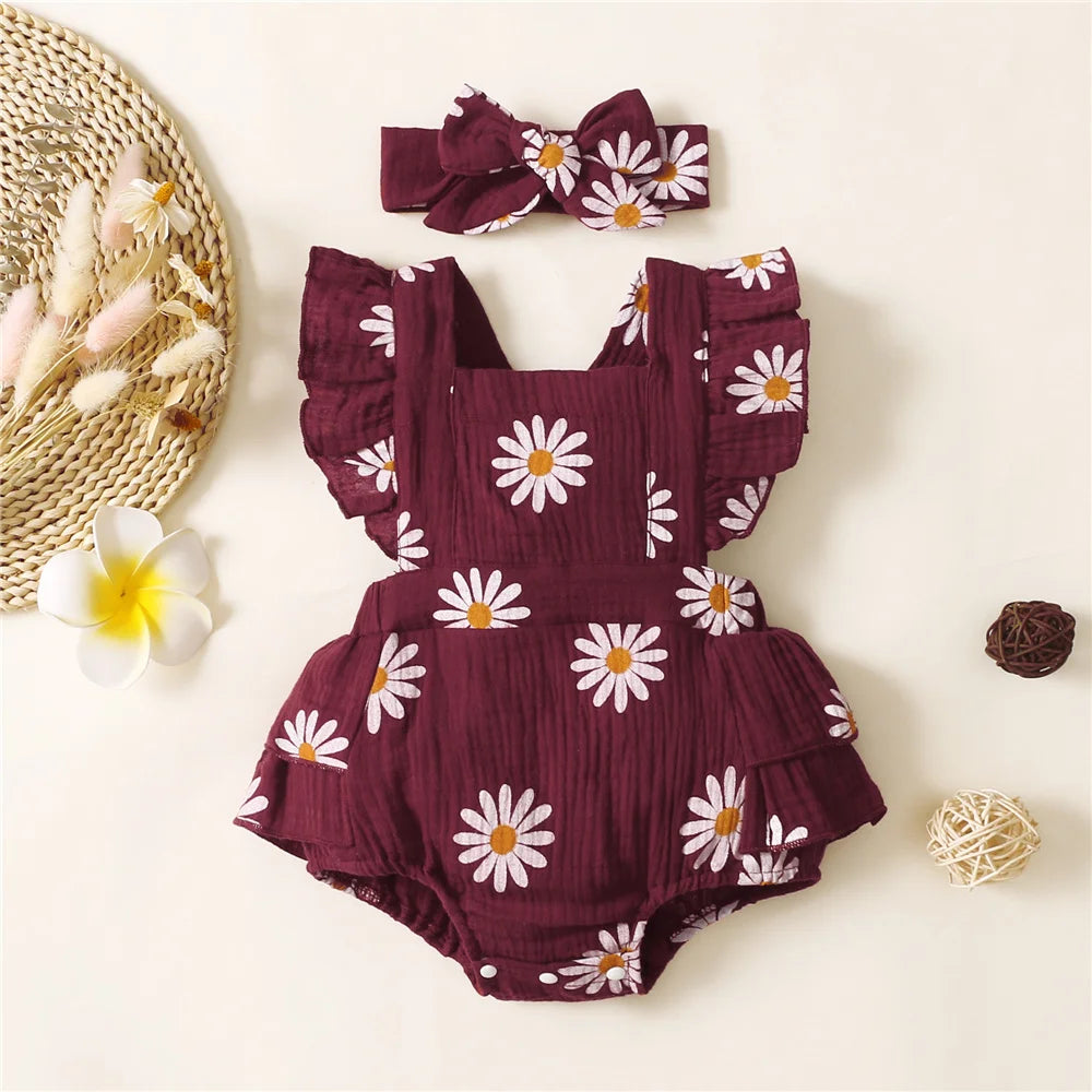 Adorable baby girl fancy romper with a headband.