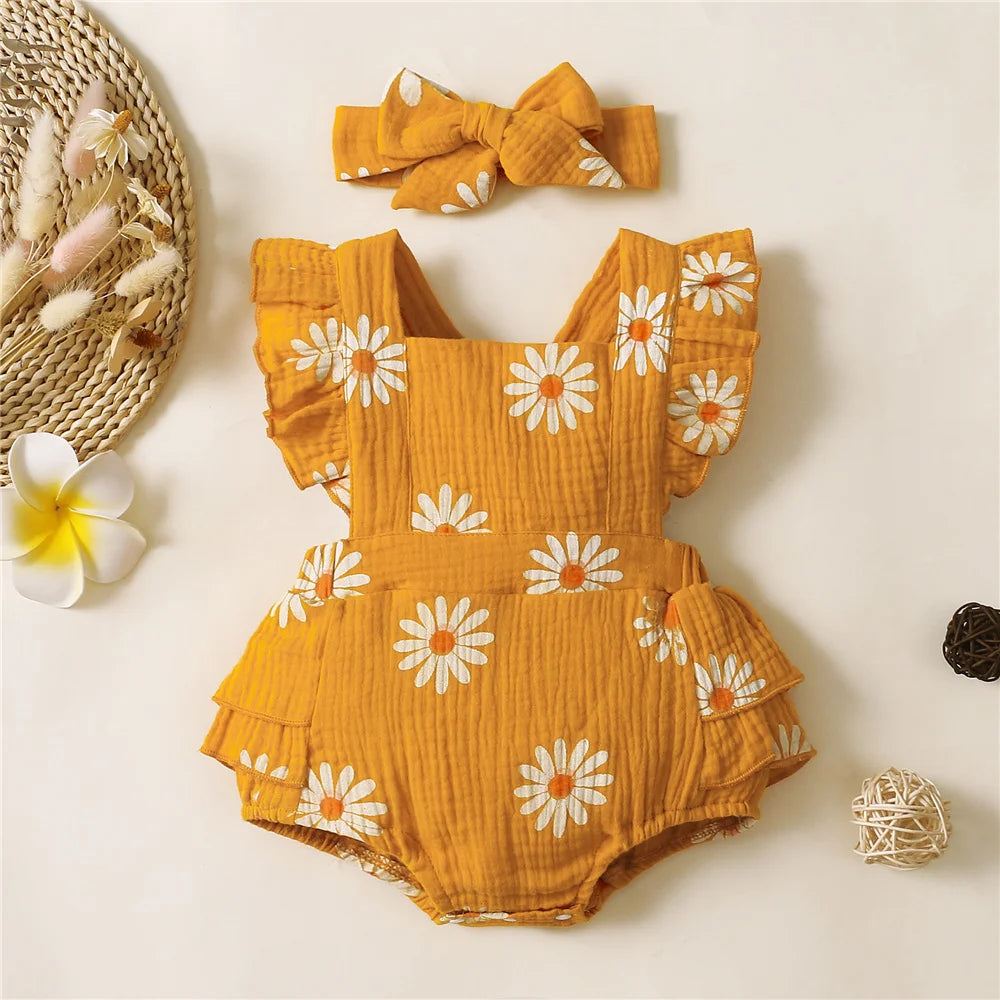 Adorable baby girl fancy romper with a headband.