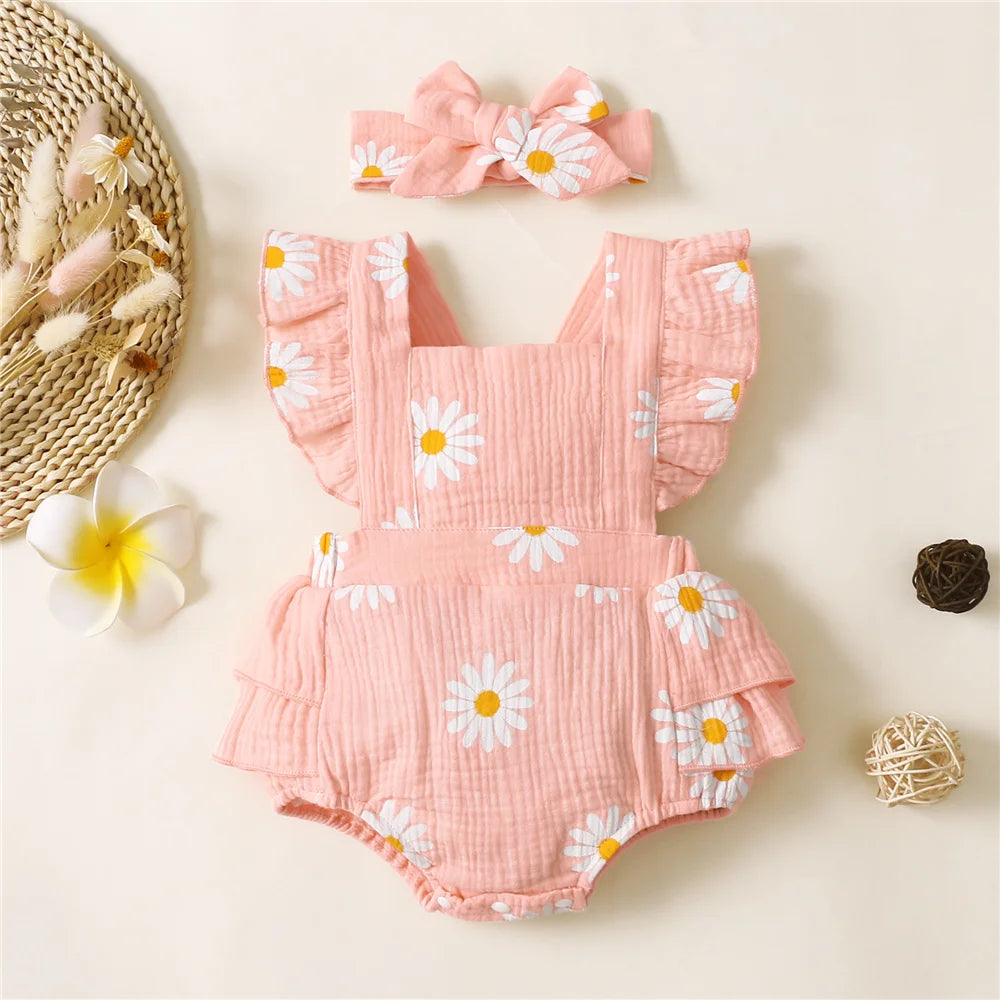 Adorable baby girl fancy romper with a headband.