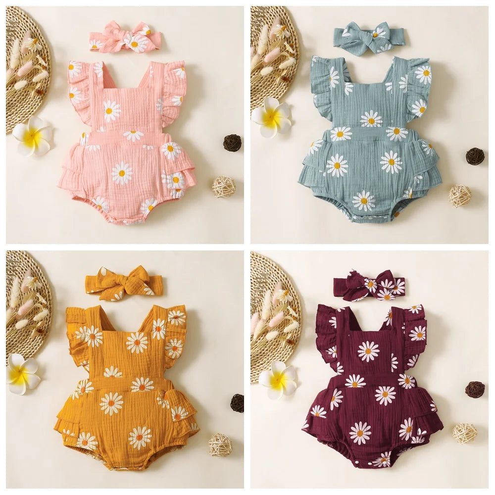 Adorable baby girl fancy romper with a headband.