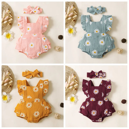 Adorable baby girl fancy romper with a headband.